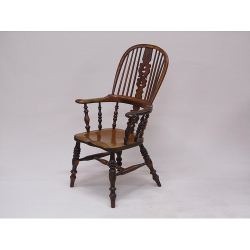 310 - A 19c Yew wood and elm hooped spindle back armchair with pierced vase splats, spindle turned raised ... 