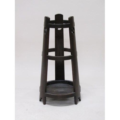 311 - An early 20c Liberty style oak stick stand, 74cm h.