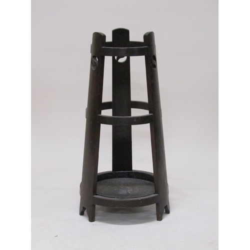 311 - An early 20c Liberty style oak stick stand, 74cm h.