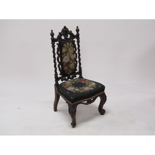 314 - A Victorian walnut upholstered prie dieu chair with a carved walnut frame, 92cm h.