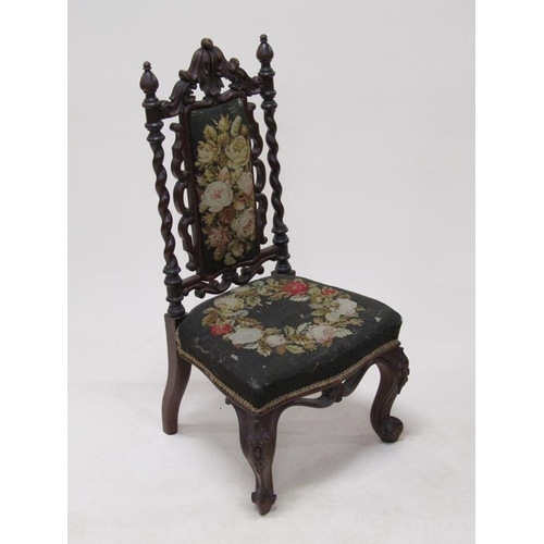 314 - A Victorian walnut upholstered prie dieu chair with a carved walnut frame, 92cm h.