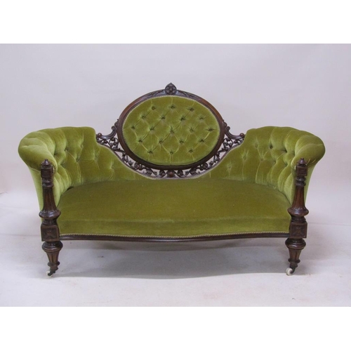 315 - A mid Victorian carved walnut show frame and upholstered two seater settee, 180cm w.