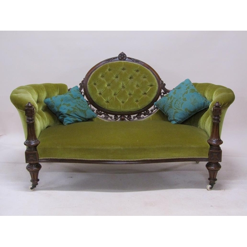 315 - A mid Victorian carved walnut show frame and upholstered two seater settee, 180cm w.