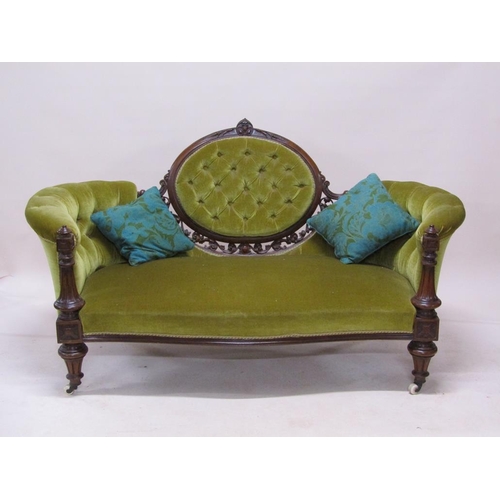 315 - A mid Victorian carved walnut show frame and upholstered two seater settee, 180cm w.