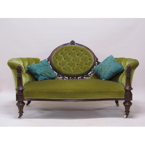 315 - A mid Victorian carved walnut show frame and upholstered two seater settee, 180cm w.