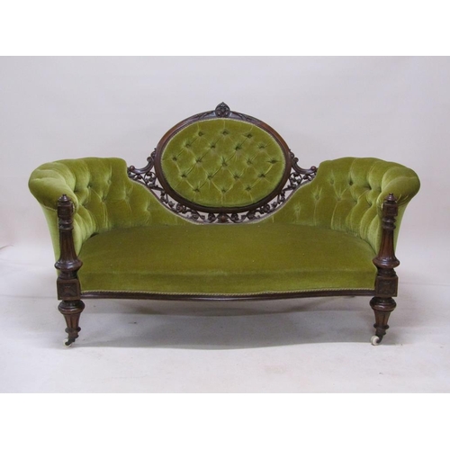 315 - A mid Victorian carved walnut show frame and upholstered two seater settee, 180cm w.