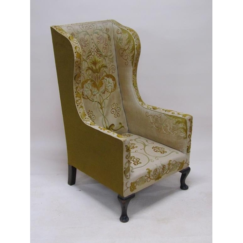 316 - A 19c, Georgian style, wood framed wing back armchair, upholstered in floral, leaf and scroll patter... 