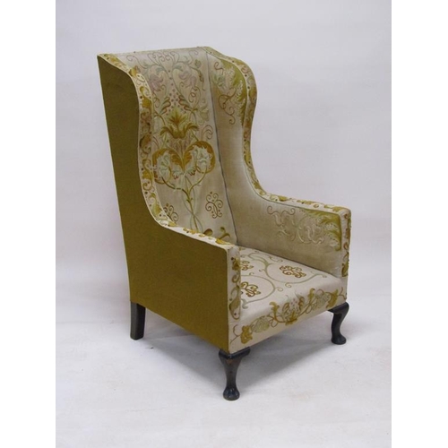 316 - A 19c, Georgian style, wood framed wing back armchair, upholstered in floral, leaf and scroll patter... 