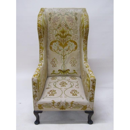 316 - A 19c, Georgian style, wood framed wing back armchair, upholstered in floral, leaf and scroll patter... 