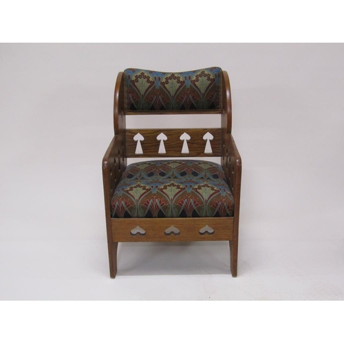 318 - An early 20c Liberty style oak armchair, 59cm w, 87cm h.