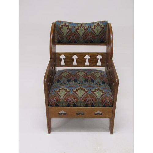 318 - An early 20c Liberty style oak armchair, 59cm w, 87cm h.