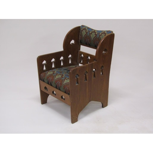 318 - An early 20c Liberty style oak armchair, 59cm w, 87cm h.