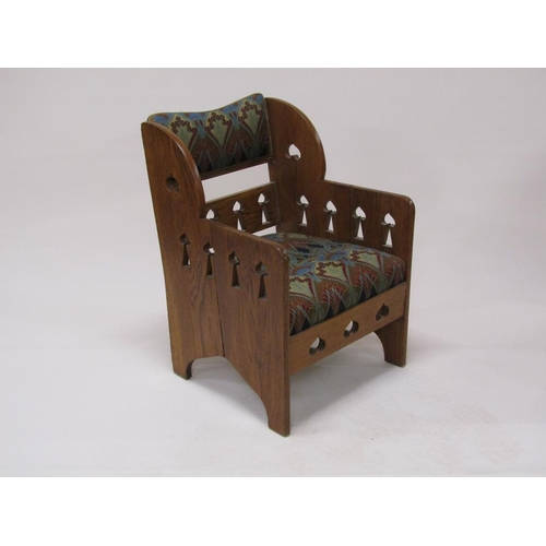 318 - An early 20c Liberty style oak armchair, 59cm w, 87cm h.