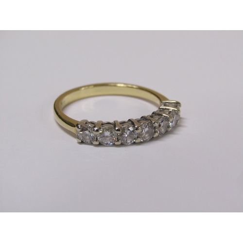 101 - An 18ct gold seven stone diamond half eternity ring, size m 1/2.