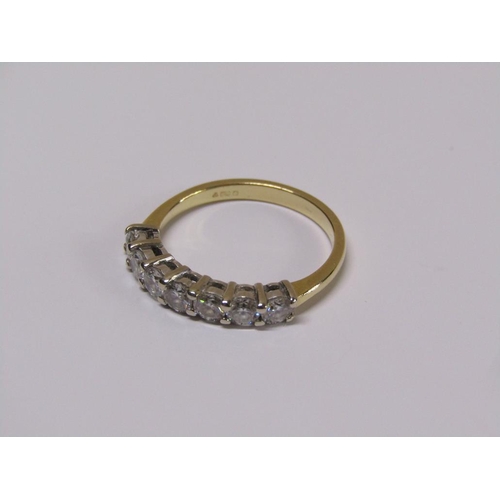 101 - An 18ct gold seven stone diamond half eternity ring, size m 1/2.