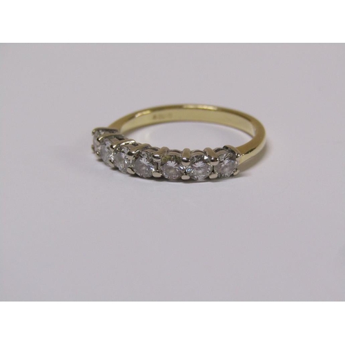 101 - An 18ct gold seven stone diamond half eternity ring, size m 1/2.