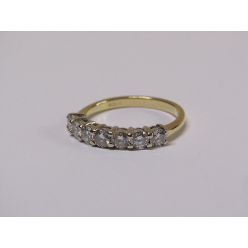 101 - An 18ct gold seven stone diamond half eternity ring, size m 1/2.