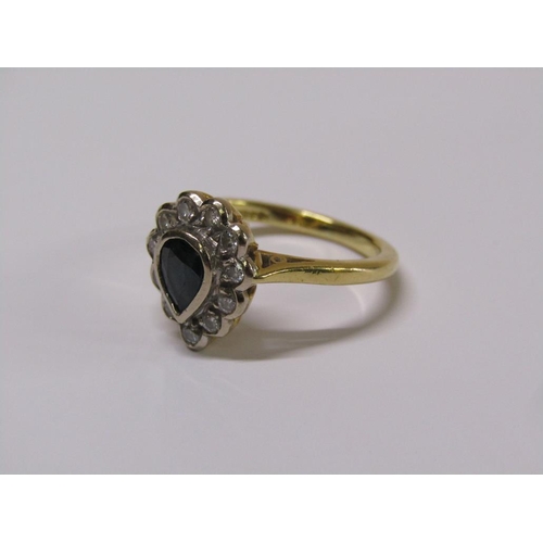 102 - An 18ct gold diamond and sapphire pear shaped ring, eleven brilliant diamonds surrounding a pear sha... 