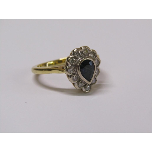 102 - An 18ct gold diamond and sapphire pear shaped ring, eleven brilliant diamonds surrounding a pear sha... 