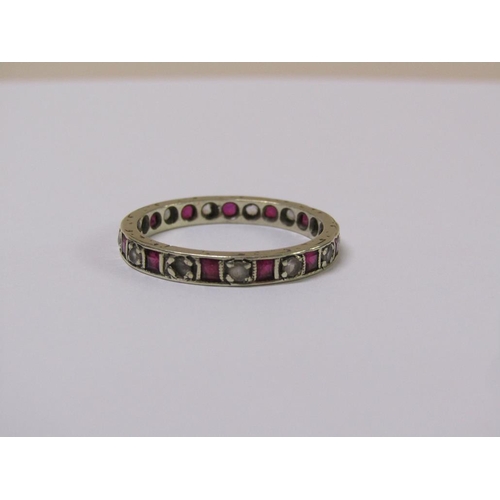 107 - A 9ct gold ruby and diamond eternity ring, size R.