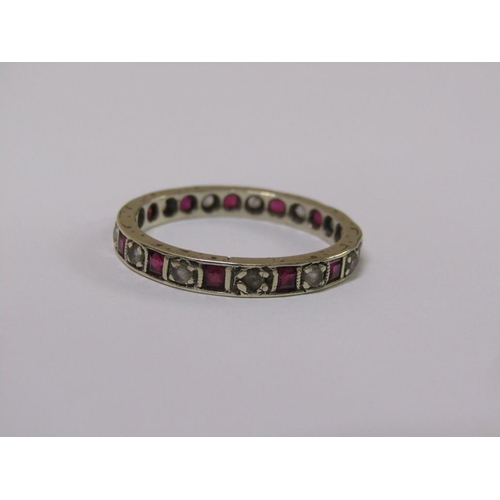 107 - A 9ct gold ruby and diamond eternity ring, size R.