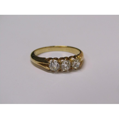 113 - A gold three stone set diamond ring, each stone approx. 1/4 ct, size N.