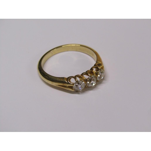 113 - A gold three stone set diamond ring, each stone approx. 1/4 ct, size N.