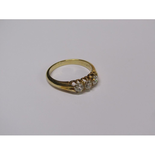 113 - A gold three stone set diamond ring, each stone approx. 1/4 ct, size N.