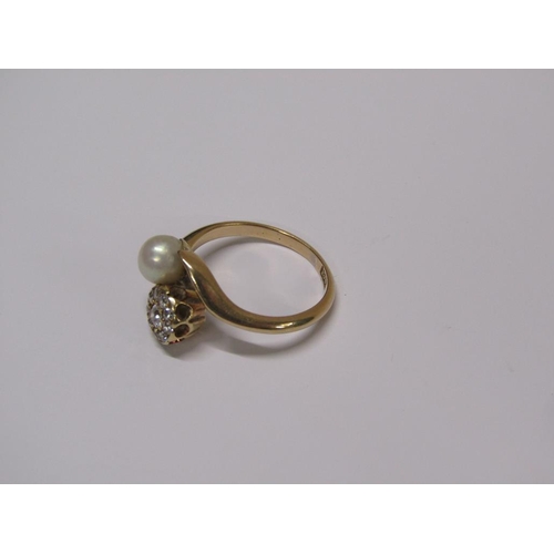 114 - An 18ct gold diamond daisy and pearl crossover ring, size L 1/2.