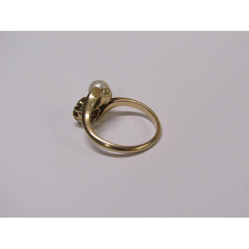 114 - An 18ct gold diamond daisy and pearl crossover ring, size L 1/2.