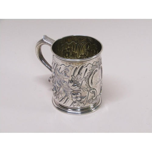 130 - An early Georgian silver tankard with later Victorian embossed decoration, makers mark for James Smi... 