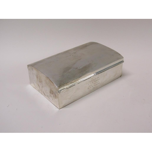 132 - An early 20c silver cigarette box of slightly domed engine turned form with wooden fitted liners, pr... 