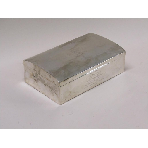 132 - An early 20c silver cigarette box of slightly domed engine turned form with wooden fitted liners, pr... 