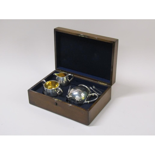 141 - A late Victorian three piece silver tea service in fitted box with a pair of tongs, makers mark for ... 