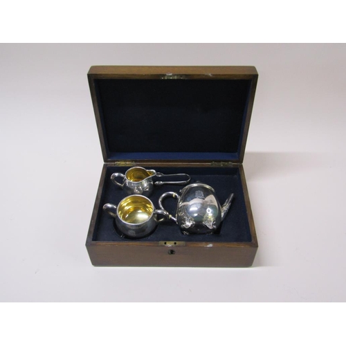 141 - A late Victorian three piece silver tea service in fitted box with a pair of tongs, makers mark for ... 