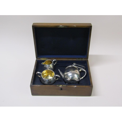 141 - A late Victorian three piece silver tea service in fitted box with a pair of tongs, makers mark for ... 