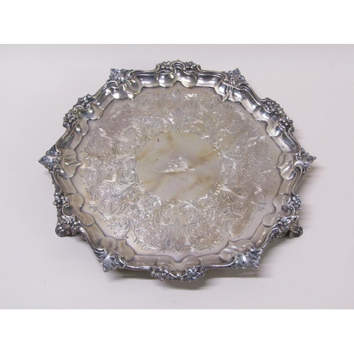 144 - An early Victorian silver salver of octagonal form with a raised and cast border, having chased base... 