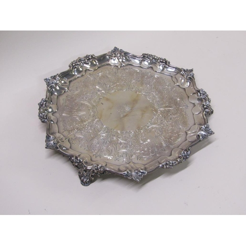 144 - An early Victorian silver salver of octagonal form with a raised and cast border, having chased base... 