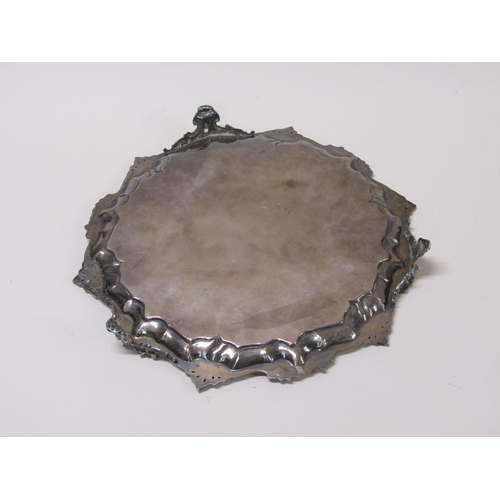 144 - An early Victorian silver salver of octagonal form with a raised and cast border, having chased base... 