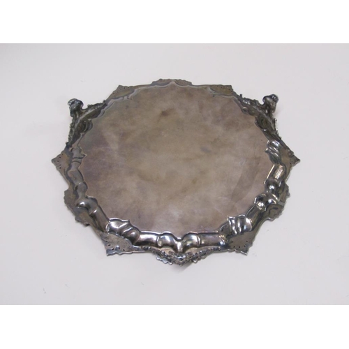 144 - An early Victorian silver salver of octagonal form with a raised and cast border, having chased base... 