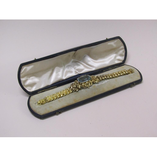 91 - A Continental gold bracelet set with a large central blue stone, in original box, 16cm l (but has tw... 