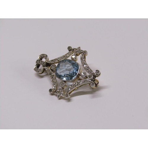 99 - A gold diamond and aquamarine set brooch of bow and swag form, central aquamarine surrounded by grad... 