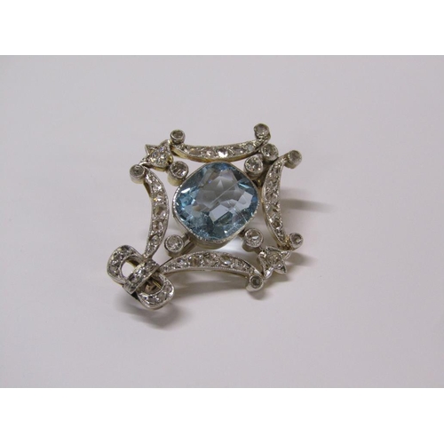 99 - A gold diamond and aquamarine set brooch of bow and swag form, central aquamarine surrounded by grad... 