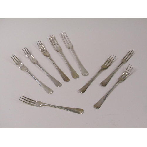 118 - A matched set of nine 18c Georgian silver three prong dessert forks, Old English pattern, 10.2ozt, e... 