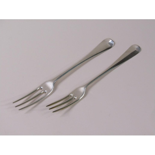 118 - A matched set of nine 18c Georgian silver three prong dessert forks, Old English pattern, 10.2ozt, e... 