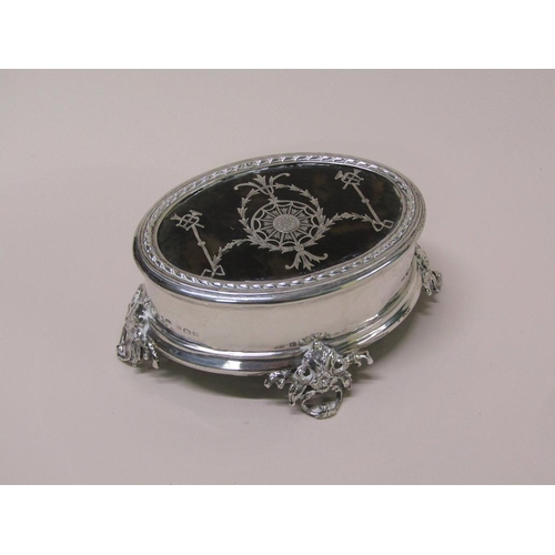 125 - An Edwardian silver jewellery box of oval form with a lift off tortoiseshell piquet decorated cover,... 