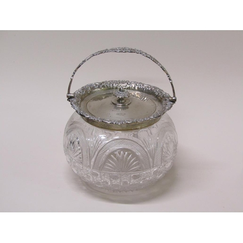 135 - An Edwardian cut glass bowl with silver mounts, lift off cover and swing handle, Sheffield 1906, 21c... 