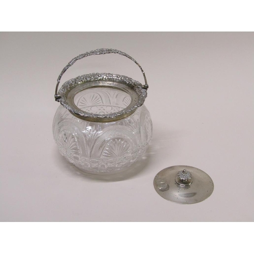 135 - An Edwardian cut glass bowl with silver mounts, lift off cover and swing handle, Sheffield 1906, 21c... 