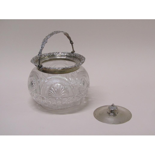 135 - An Edwardian cut glass bowl with silver mounts, lift off cover and swing handle, Sheffield 1906, 21c... 