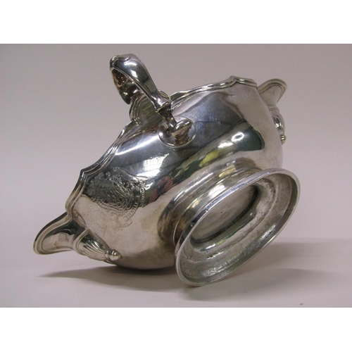 138 - A Georgian style silver sauce tureen, double lipped and having two scrolling handles, London 1972, 2... 